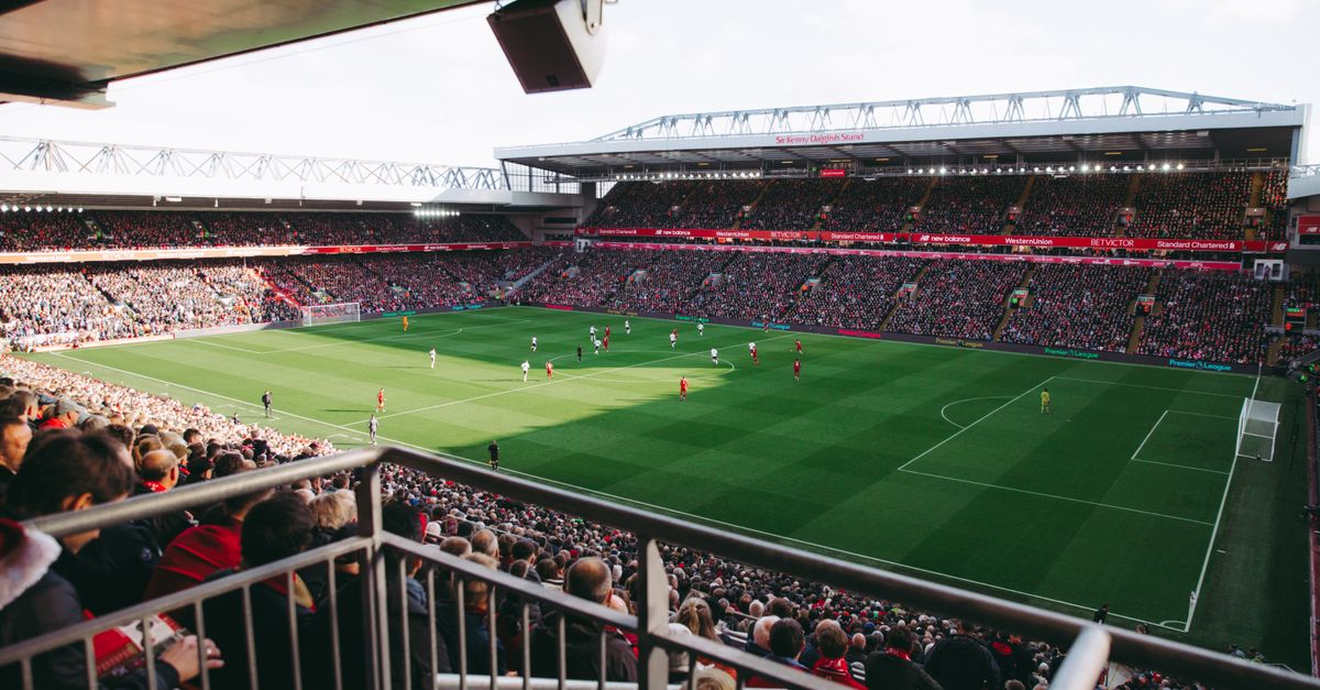 A vibrant soccer game with a full crowd in a modern stadium, capturing the energy of the sport.